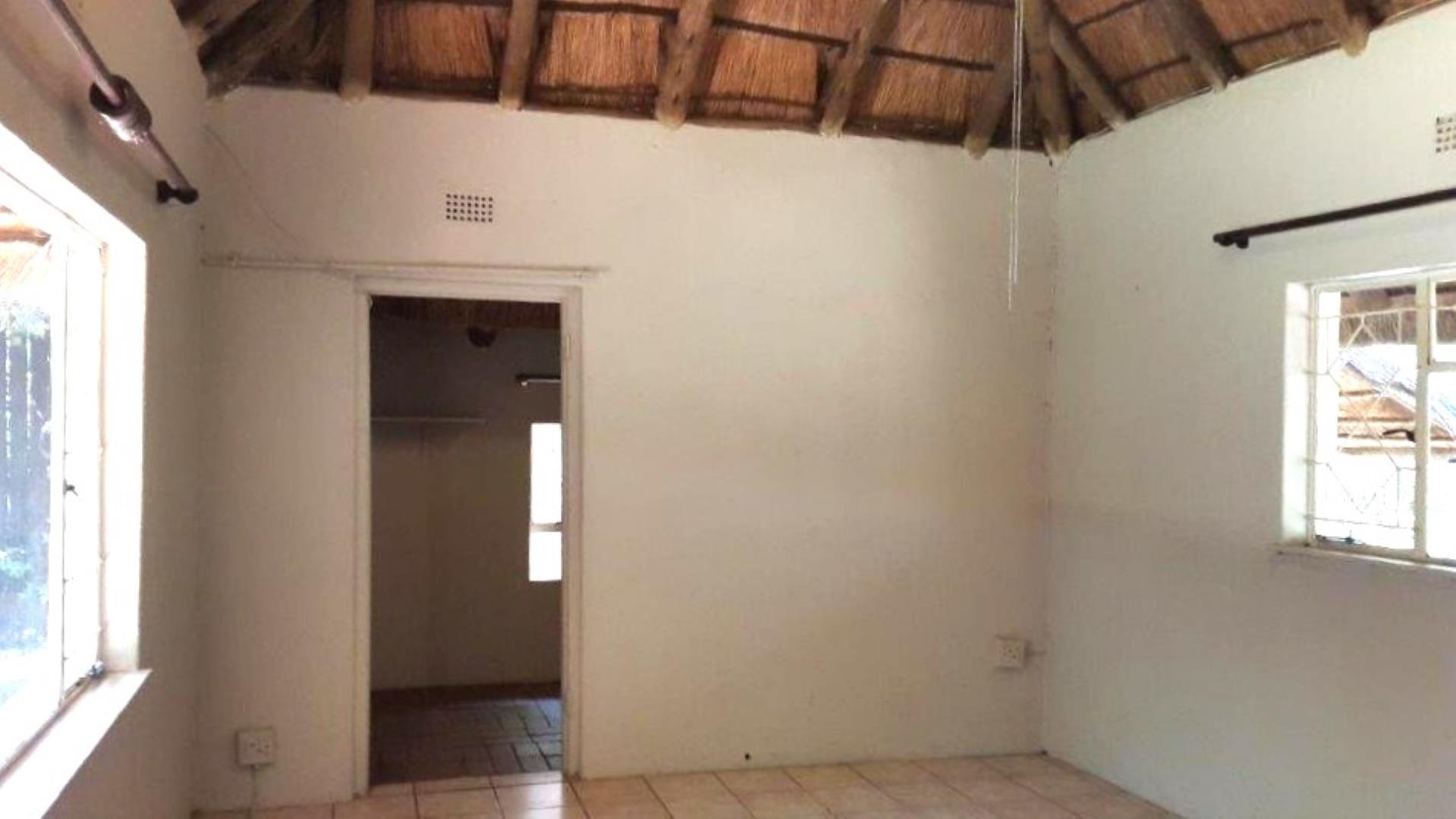 766429_Thatch_cottage_lounge_into_study.jpg
